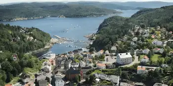 Aerial view of Tvedestrand, a small town in Norway, showcasing its scenic beauty and urban layout.